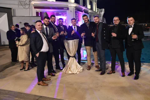 Guests gathered around a table at an event