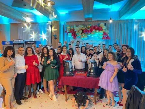 Group photo in a decorated celebration hall