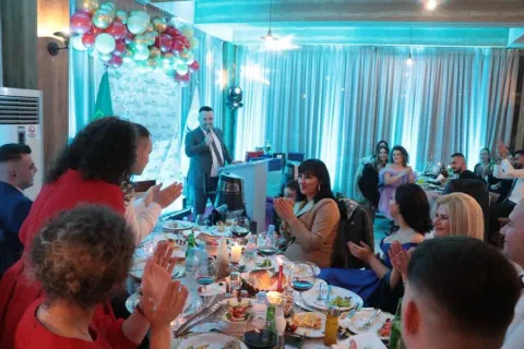Guests seated around a celebration table